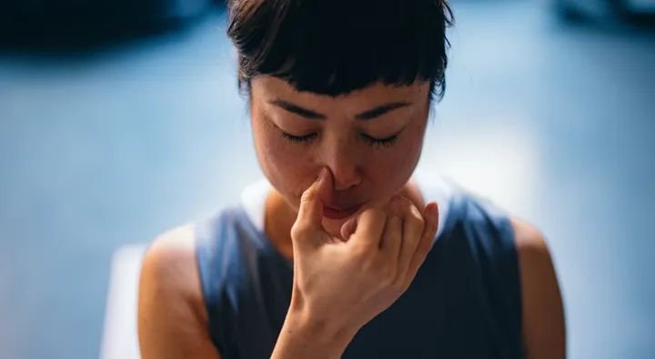 Person practicing simple yoga stretches at home